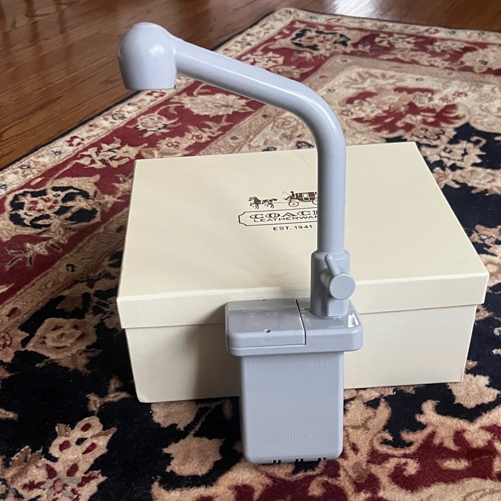 Gray faucet toy